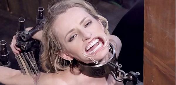  Gagged brunette tormented in device bondage